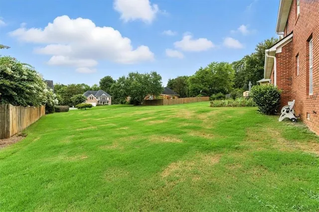 a backyard of a house with lots of green space