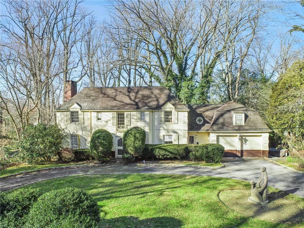 Impressive circular driveway leads you to this stunning classic colonial in the heart of Scarsdale!