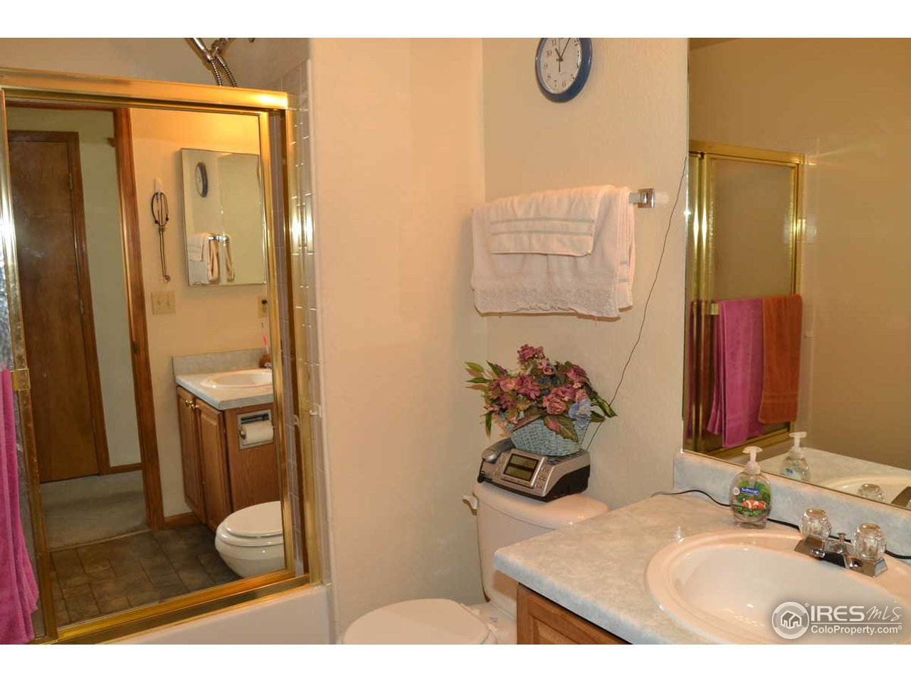1321 Trail Ridge Road Longmont, CO 80504 - Photo 13 of 25 a bathroom with a sink toilet and shower