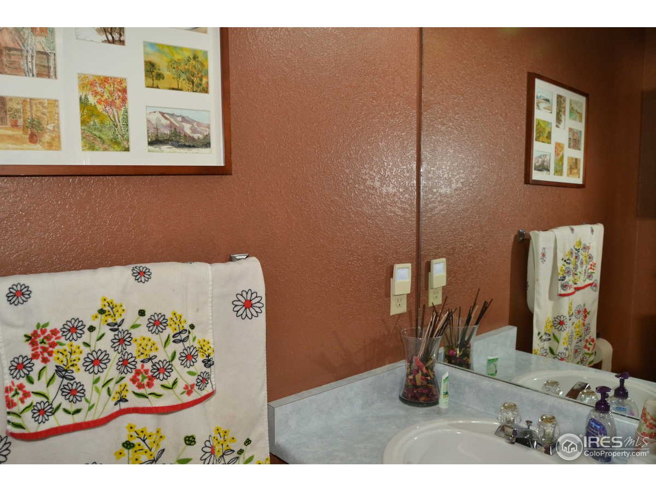 1321 Trail Ridge Road Longmont, CO 80504 - Photo 21 of 25 a bedroom with a bed and a dresser