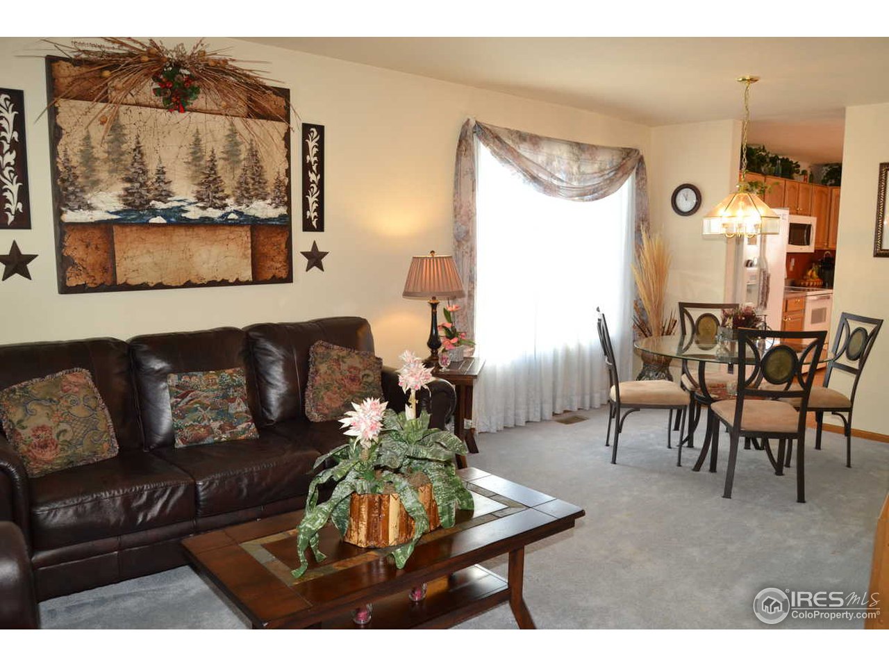 1321 Trail Ridge Road Longmont, CO 80504 - Photo 3 of 25 a living room with furniture and a large window