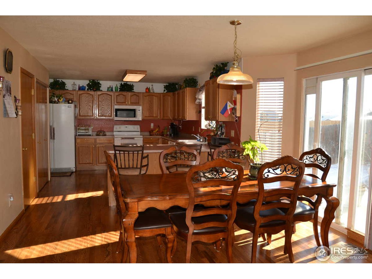 1321 Trail Ridge Road Longmont, CO 80504 - Photo 9 of 25 a view of a dining room with furniture and chandelier