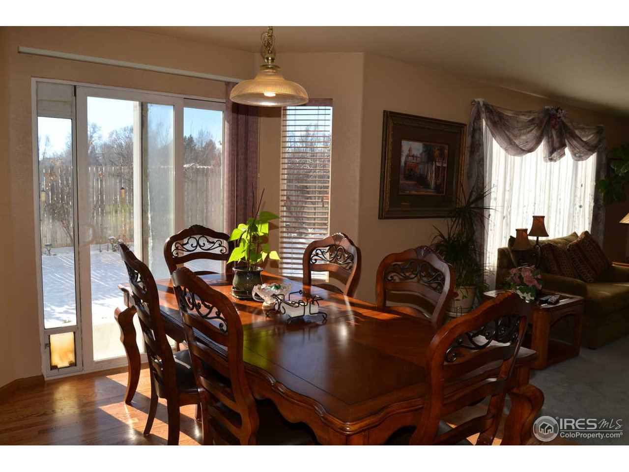 1321 Trail Ridge Road Longmont, CO 80504 - Photo 10 of 25 a view of a dining room with furniture and chandelier