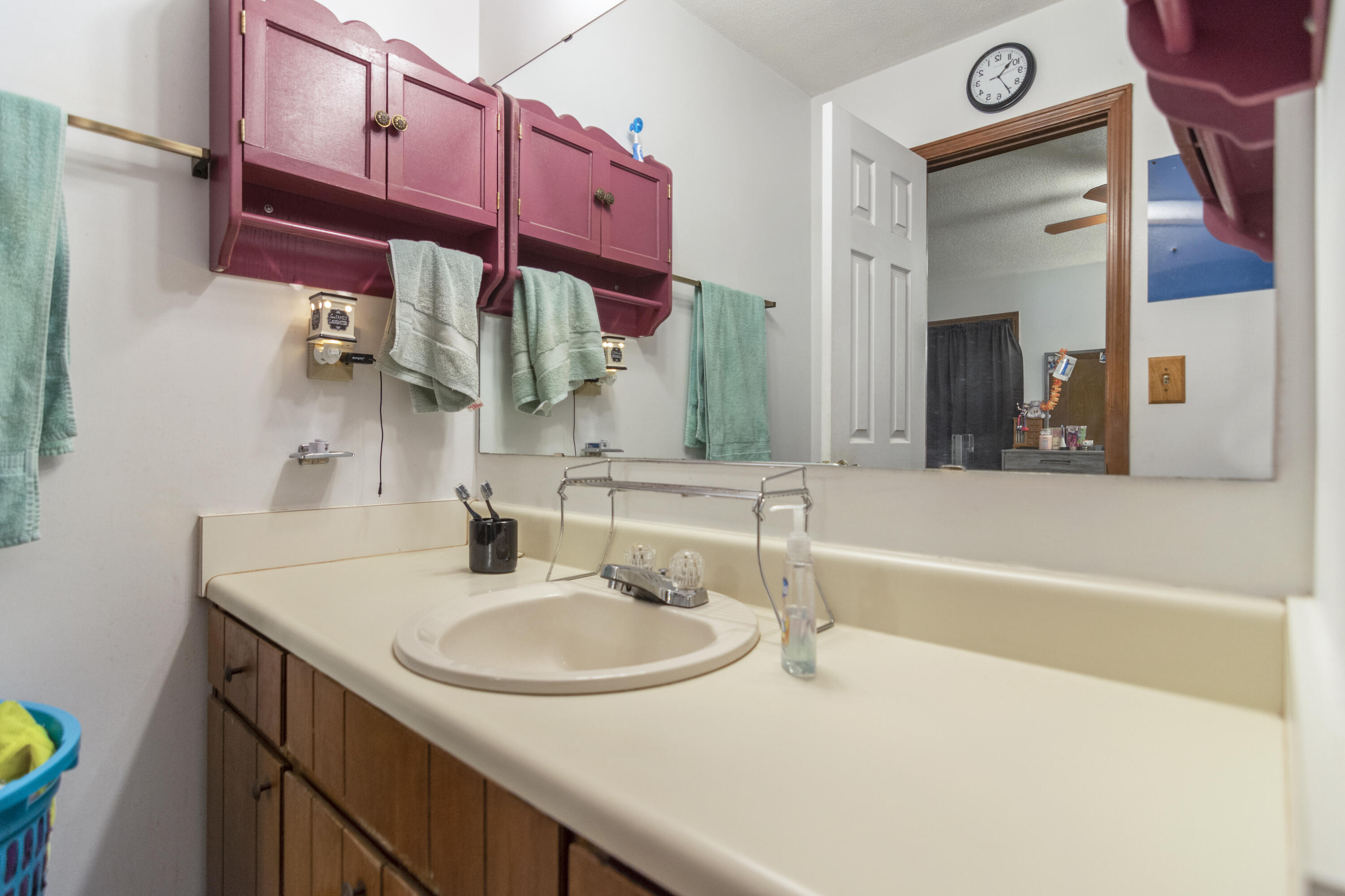 414 Ashley Drive Crestview, FL 32536 - Photo 12 of 29 a bathroom with a sink and a mirror