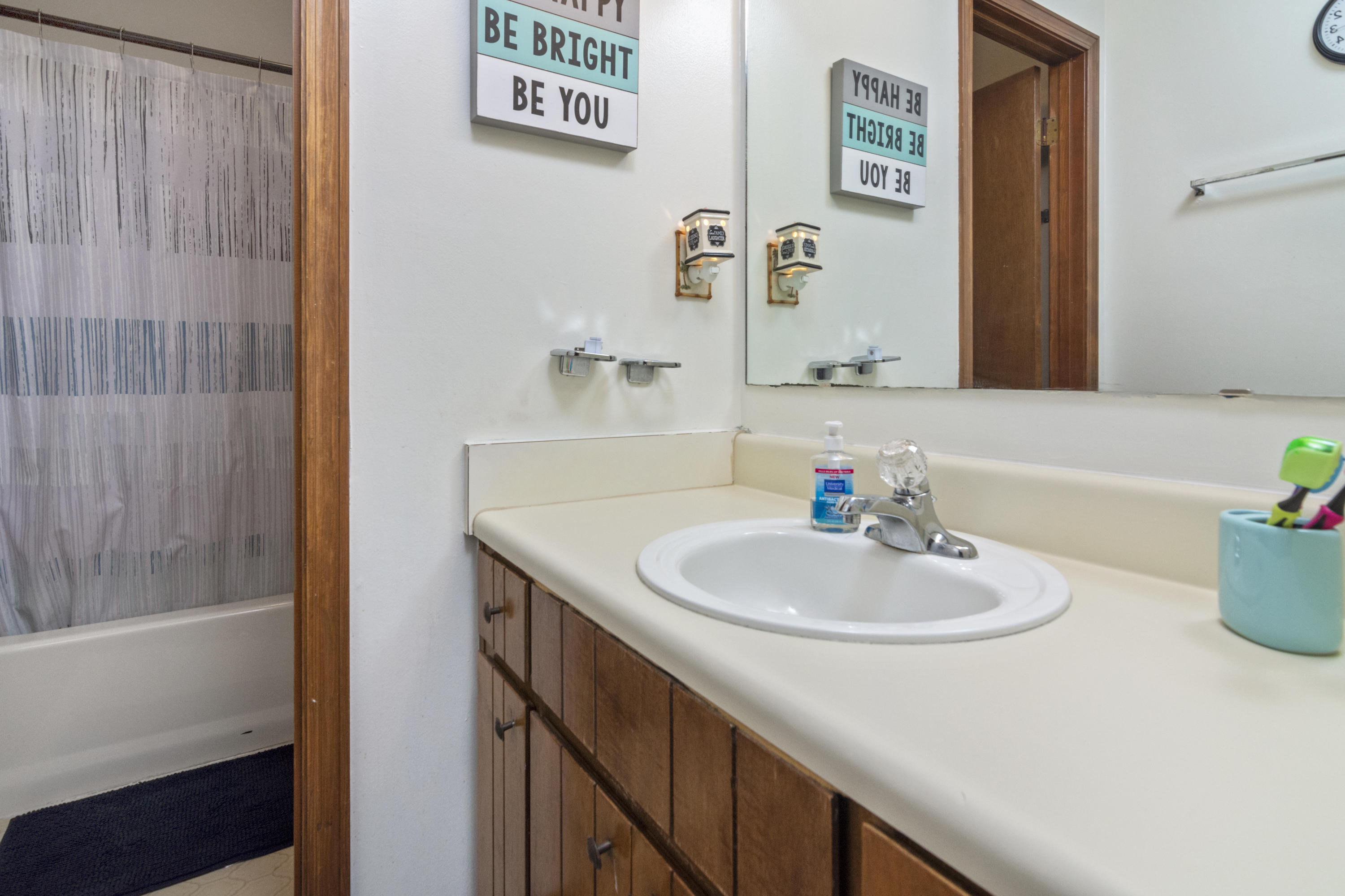 414 Ashley Drive Crestview, FL 32536 - Photo 15 of 29 a bathroom with a sink and a mirror