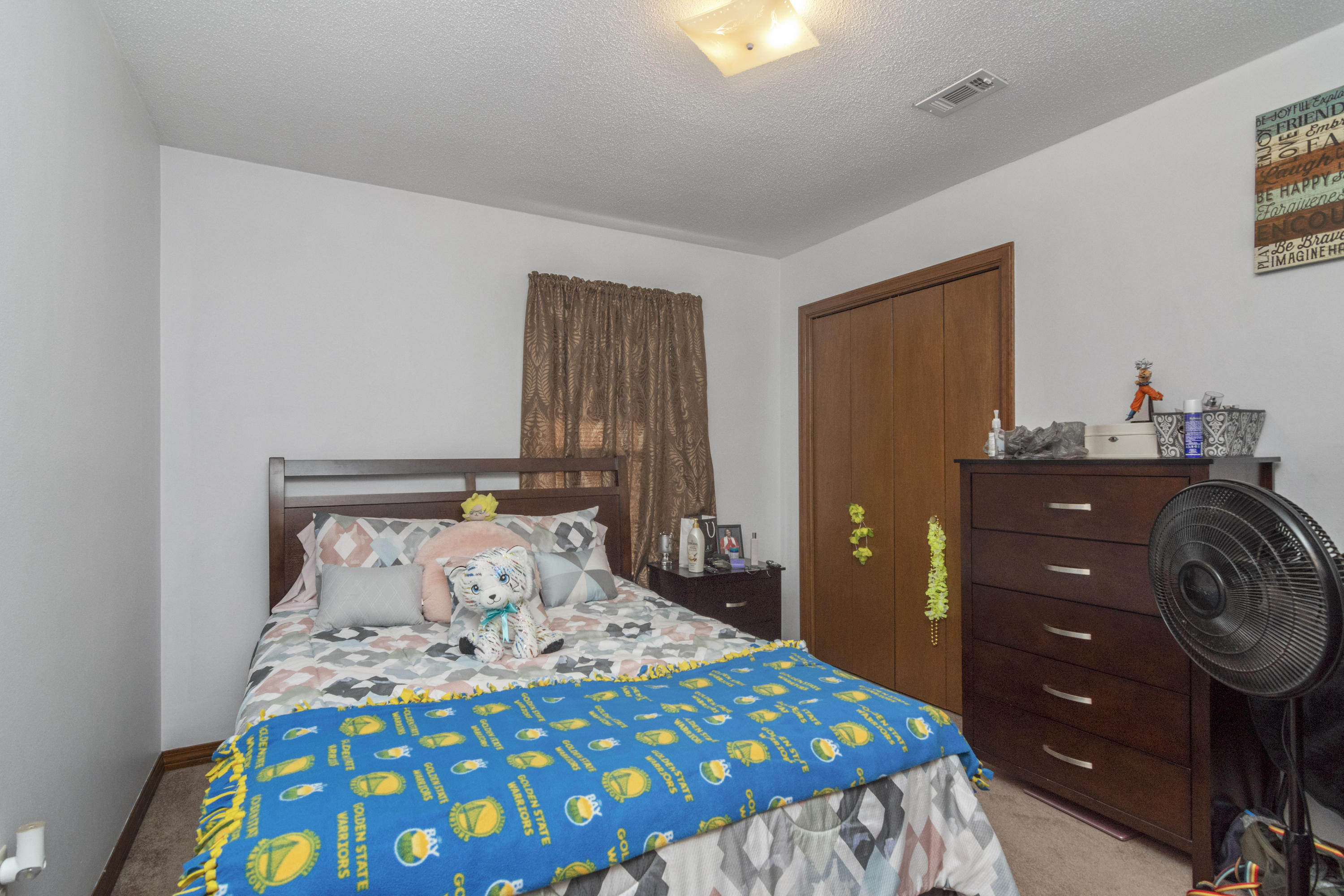 414 Ashley Drive Crestview, FL 32536 - Photo 17 of 29 a bedroom with a bed and a dresser