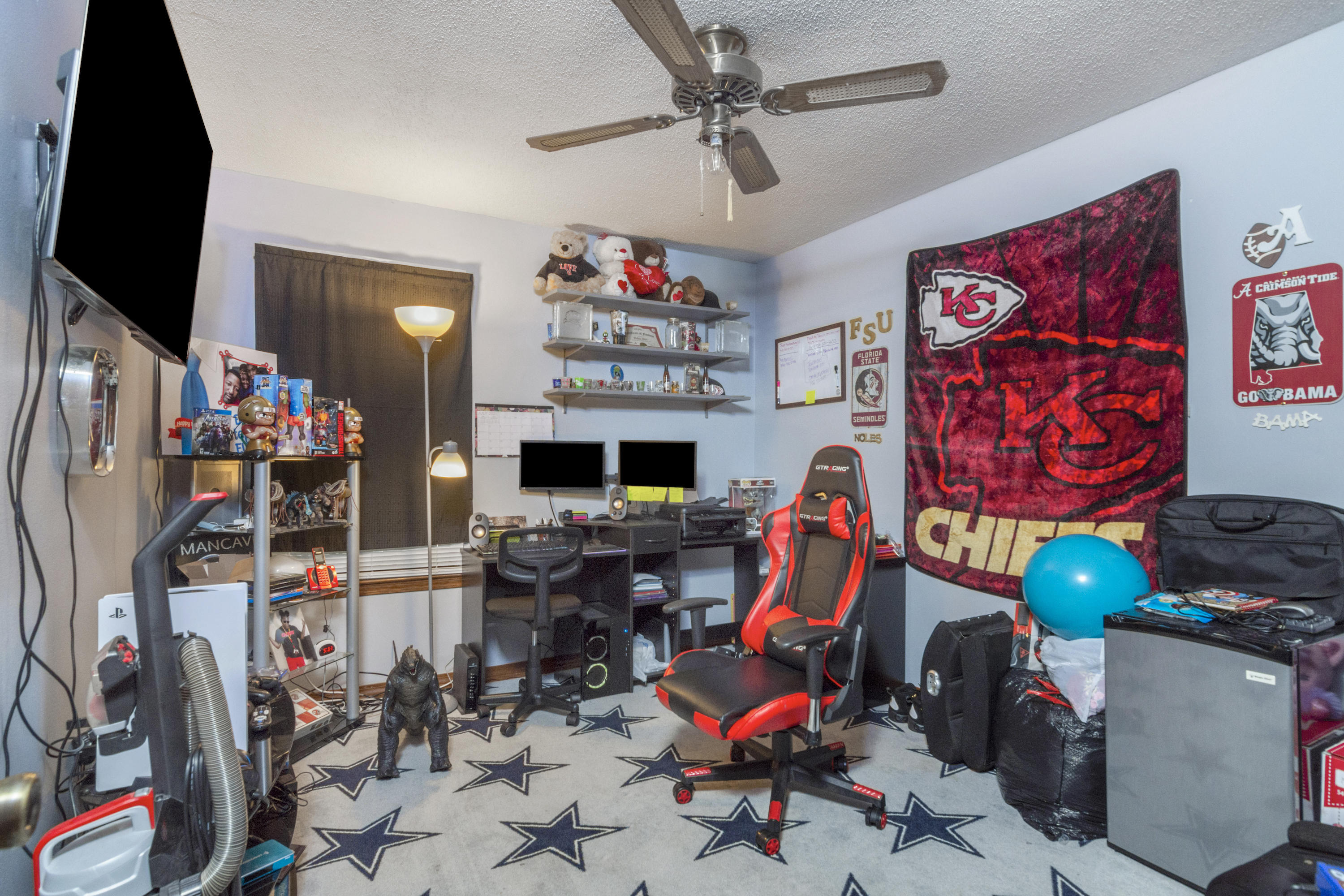 414 Ashley Drive Crestview, FL 32536 - Photo 21 of 29 a room with gym equipment and a flat screen tv