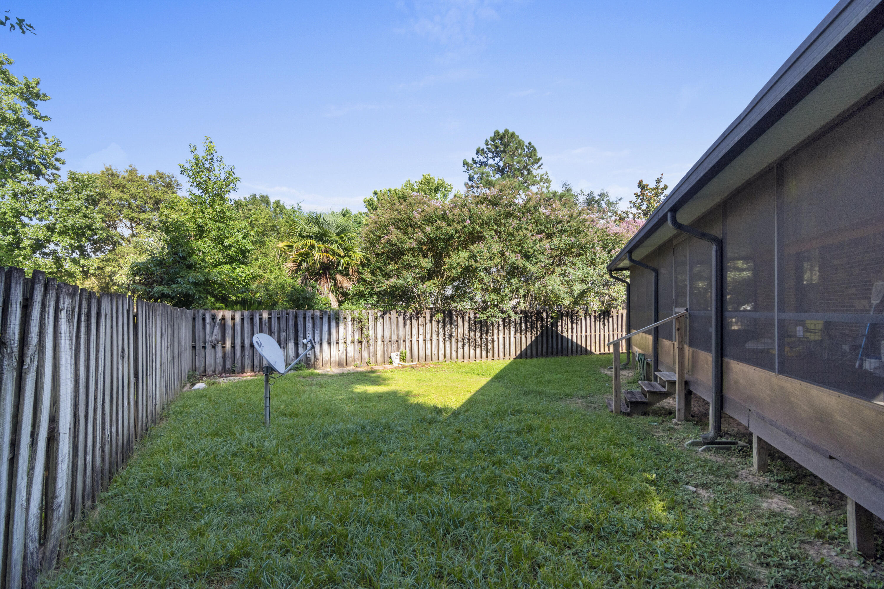 414 Ashley Drive Crestview, FL 32536 - Photo 27 of 29 a view of a backyard with a garden