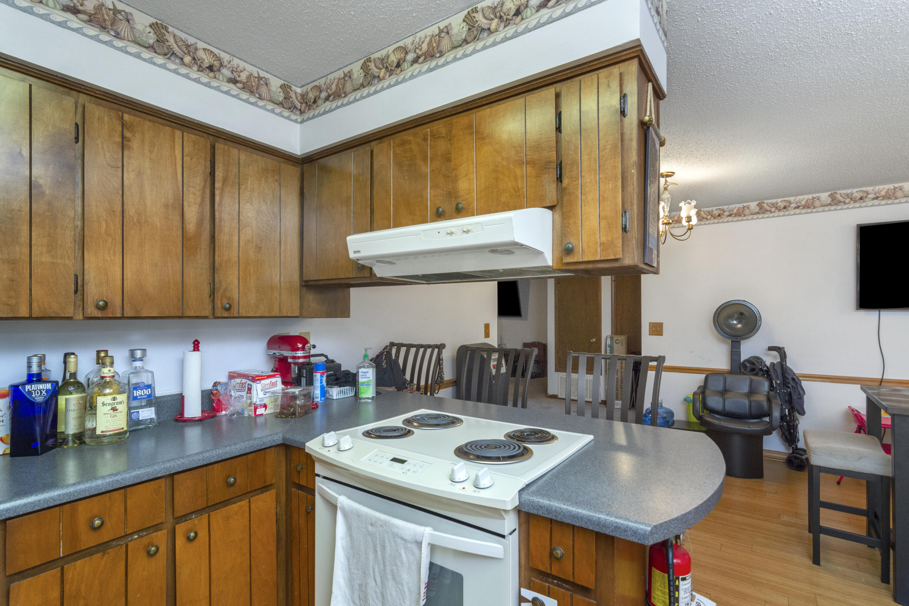 414 Ashley Drive Crestview, FL 32536 - Photo 9 of 29 a kitchen with stainless steel appliances granite countertop a sink stove and cabinets
