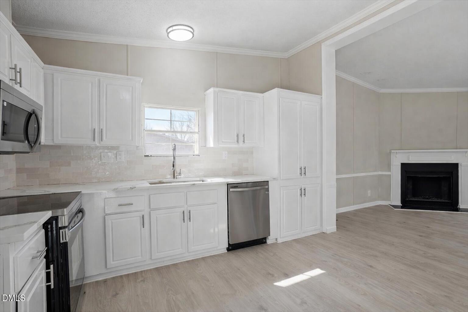 10965 Beaver Dam Road Middlesex, NC 27557 - Photo 10 of 24 a kitchen with a sink cabinets and a window