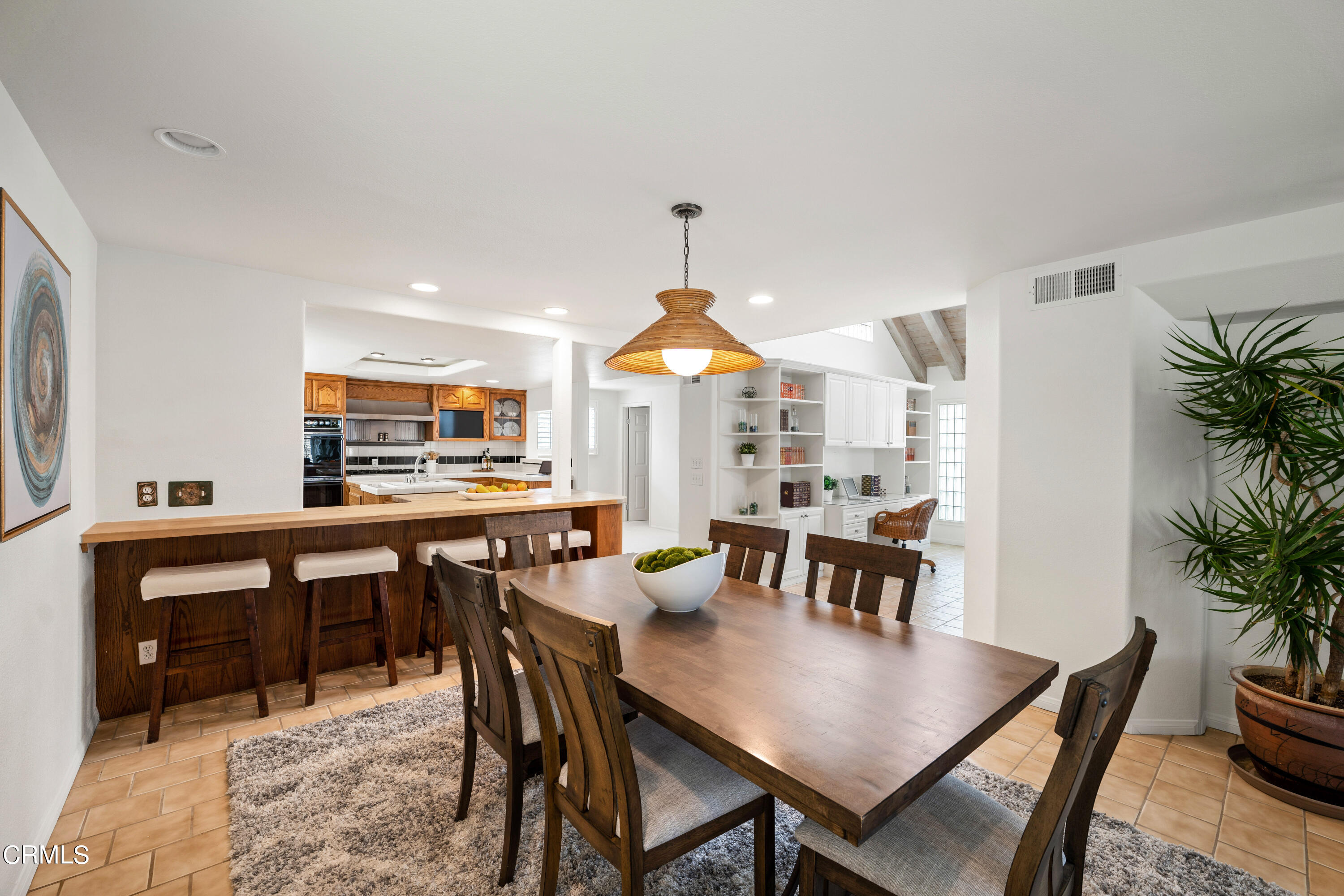 3736 Ocean Drive Oxnard, CA 93035 - Photo 14 of 35 a view of a a dining room with furniture window and wooden floor