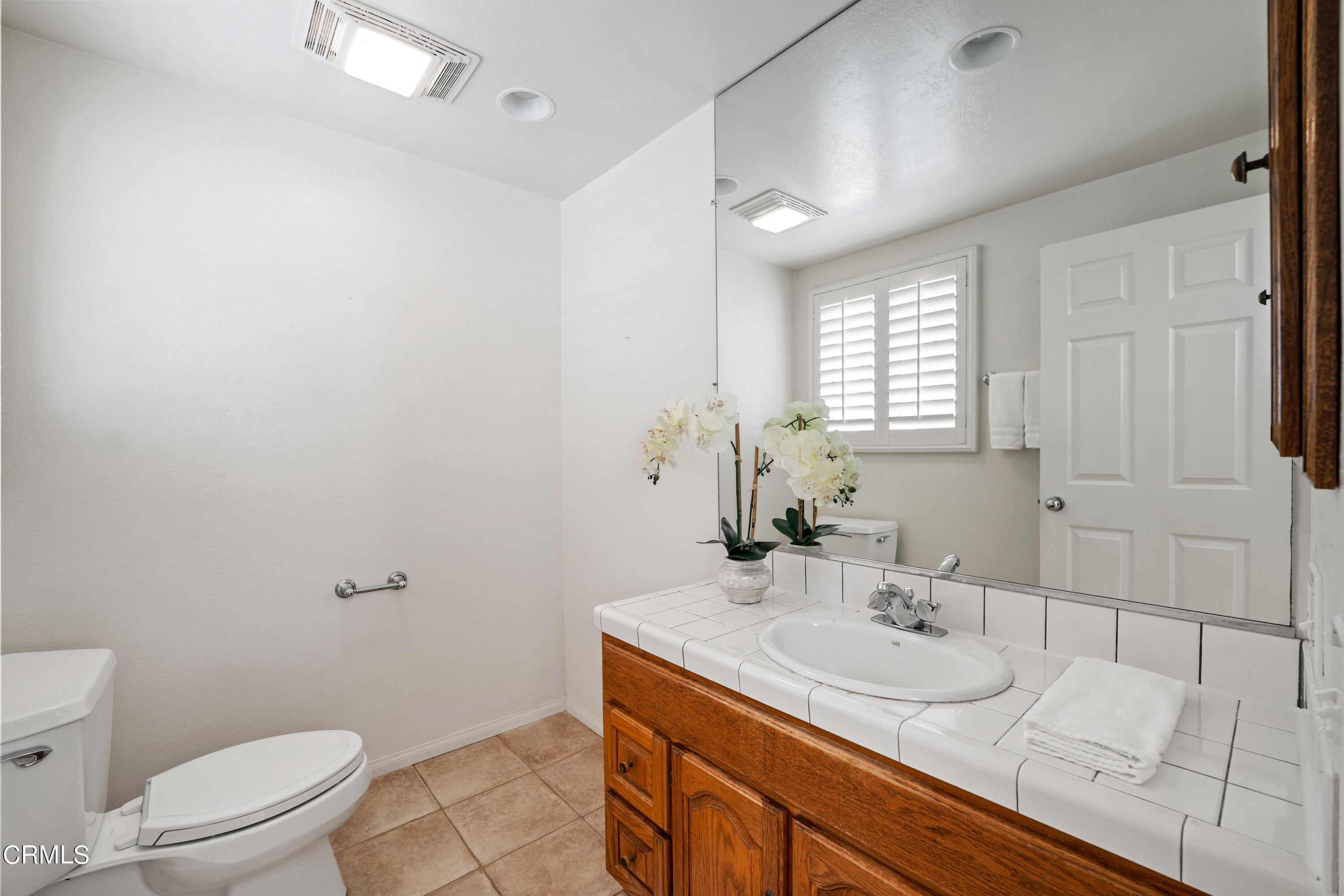 3736 Ocean Drive Oxnard, CA 93035 - Photo 16 of 35 a bathroom with a sink toilet and mirror