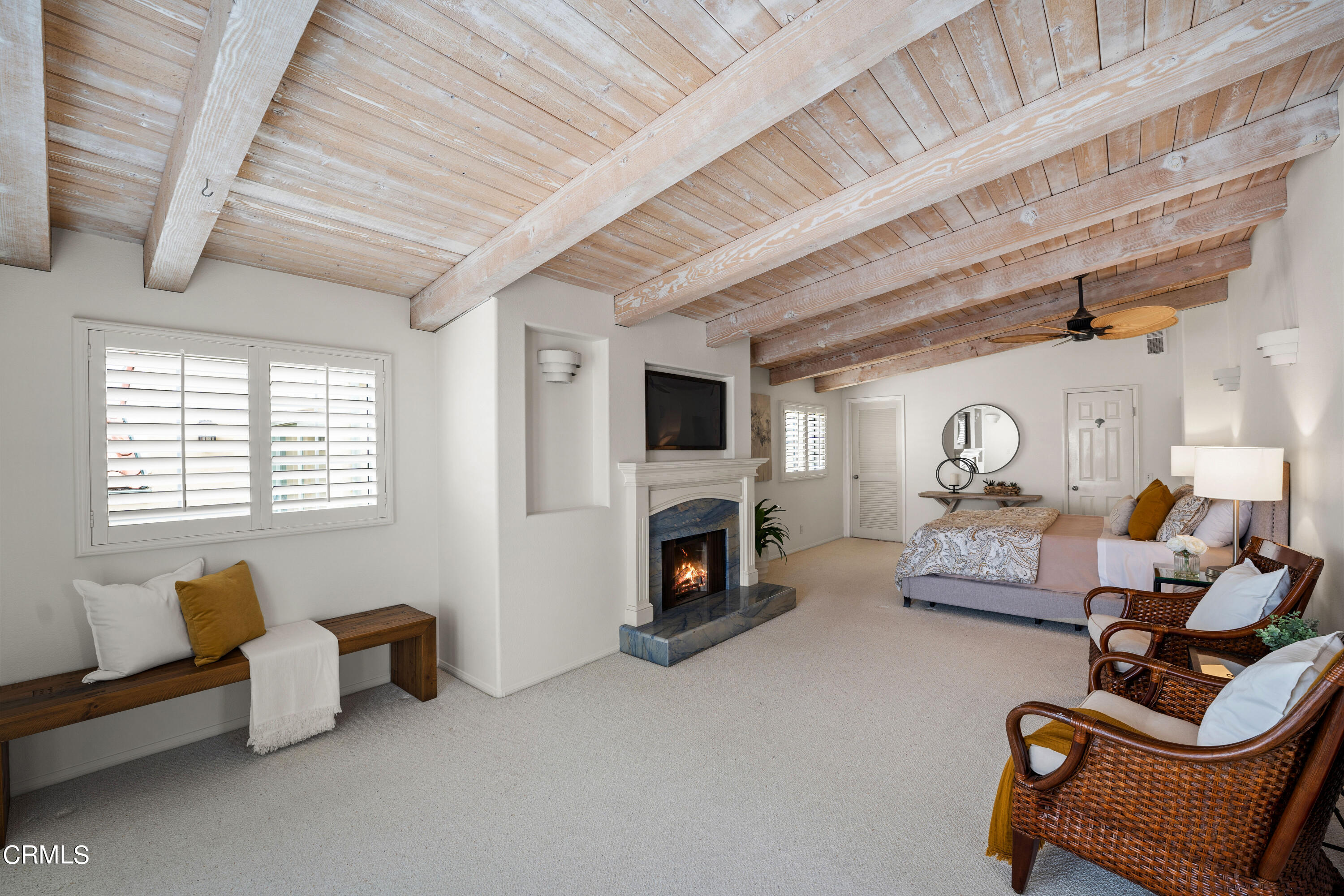 3736 Ocean Drive Oxnard, CA 93035 - Photo 20 of 35 a bedroom with furniture and a fireplace