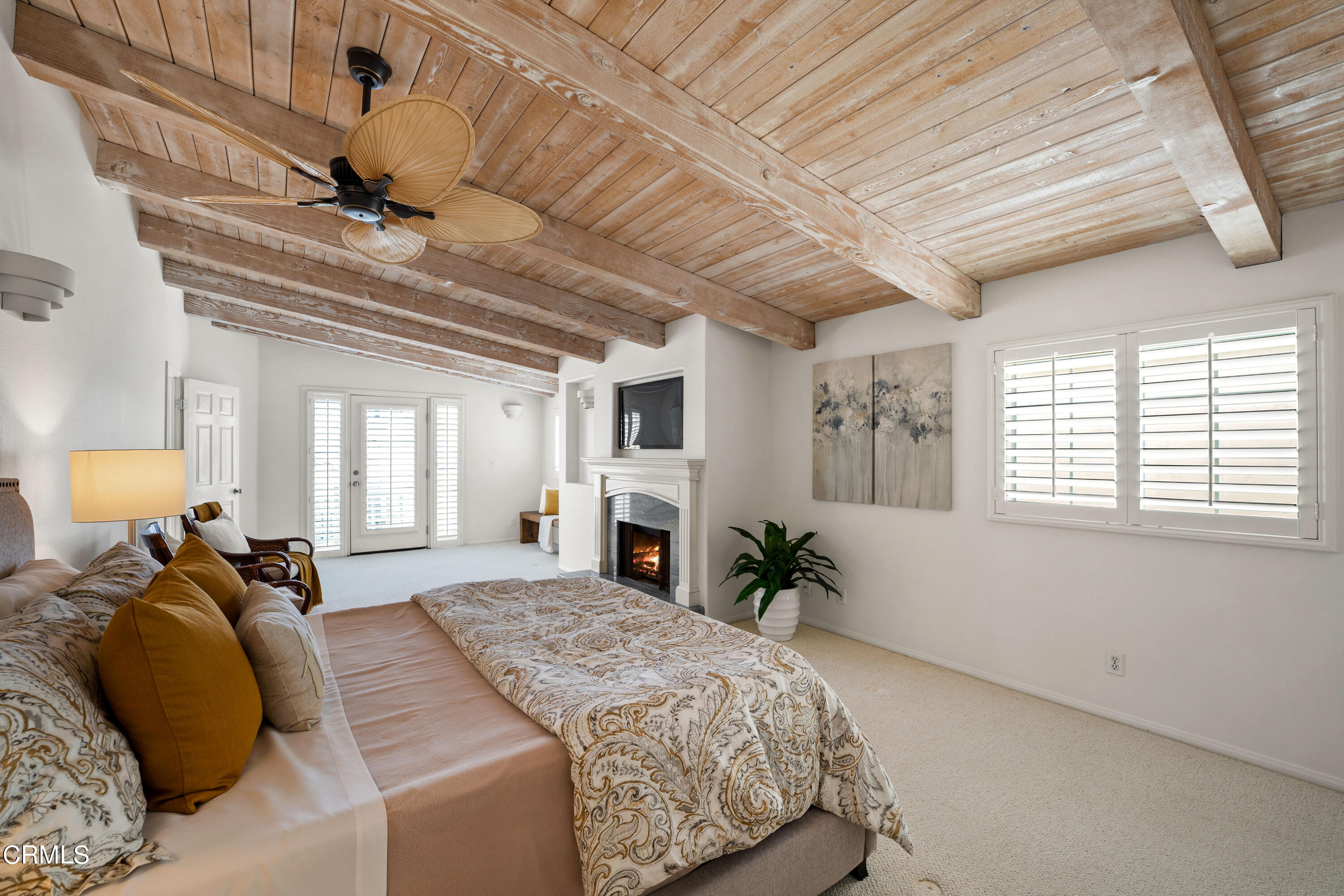 3736 Ocean Drive Oxnard, CA 93035 - Photo 21 of 35 a bed room with a bed window and a chandelier