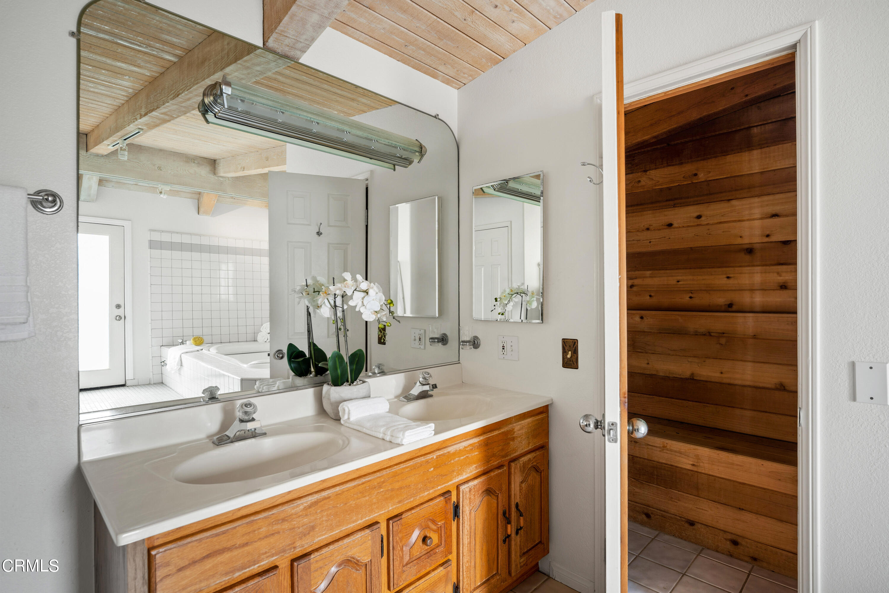 3736 Ocean Drive Oxnard, CA 93035 - Photo 23 of 35 a bathroom with a sink and a mirror