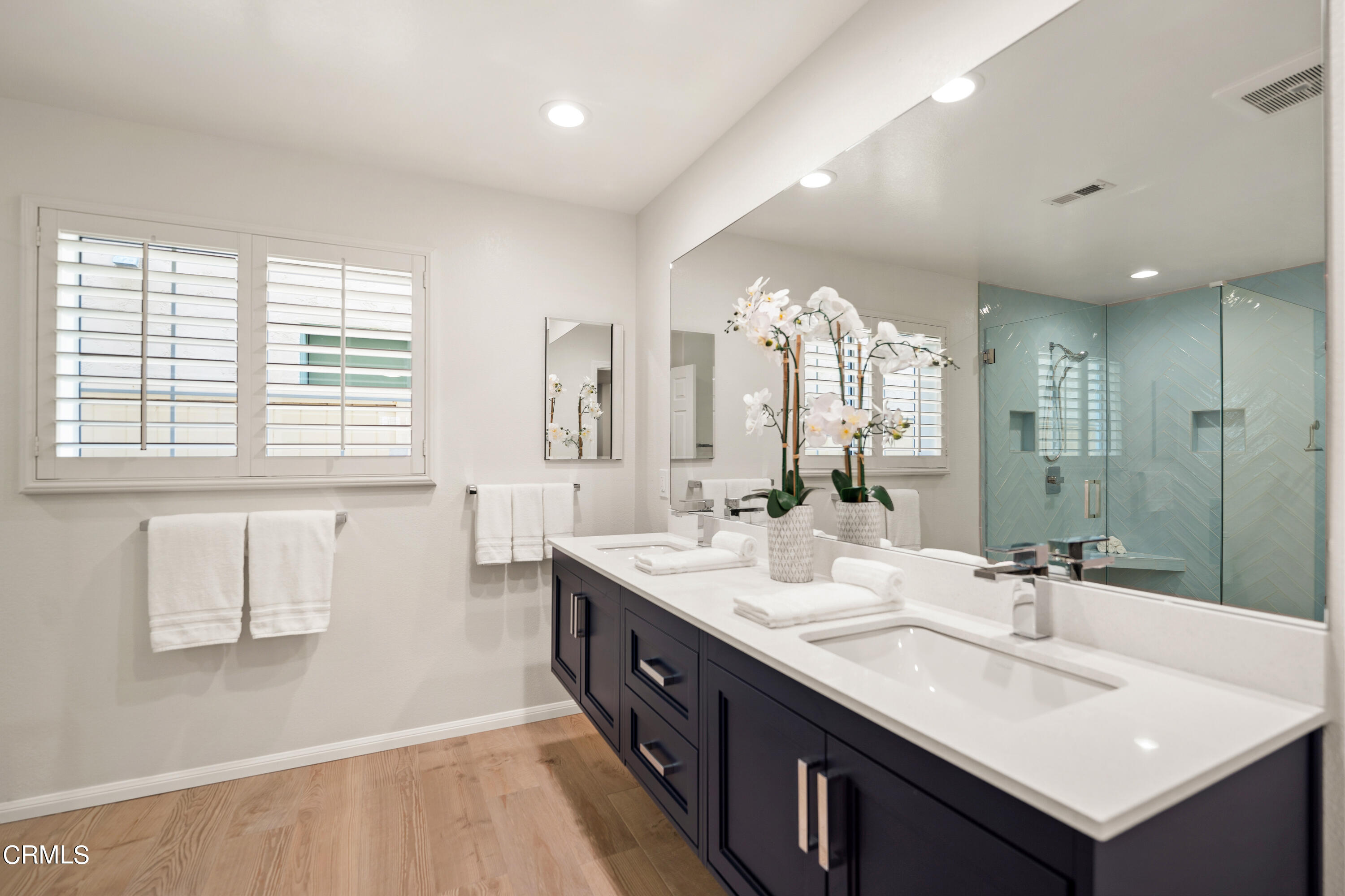 3736 Ocean Drive Oxnard, CA 93035 - Photo 31 of 35 a spacious bathroom with a double vanity sink mirror and a bathtub
