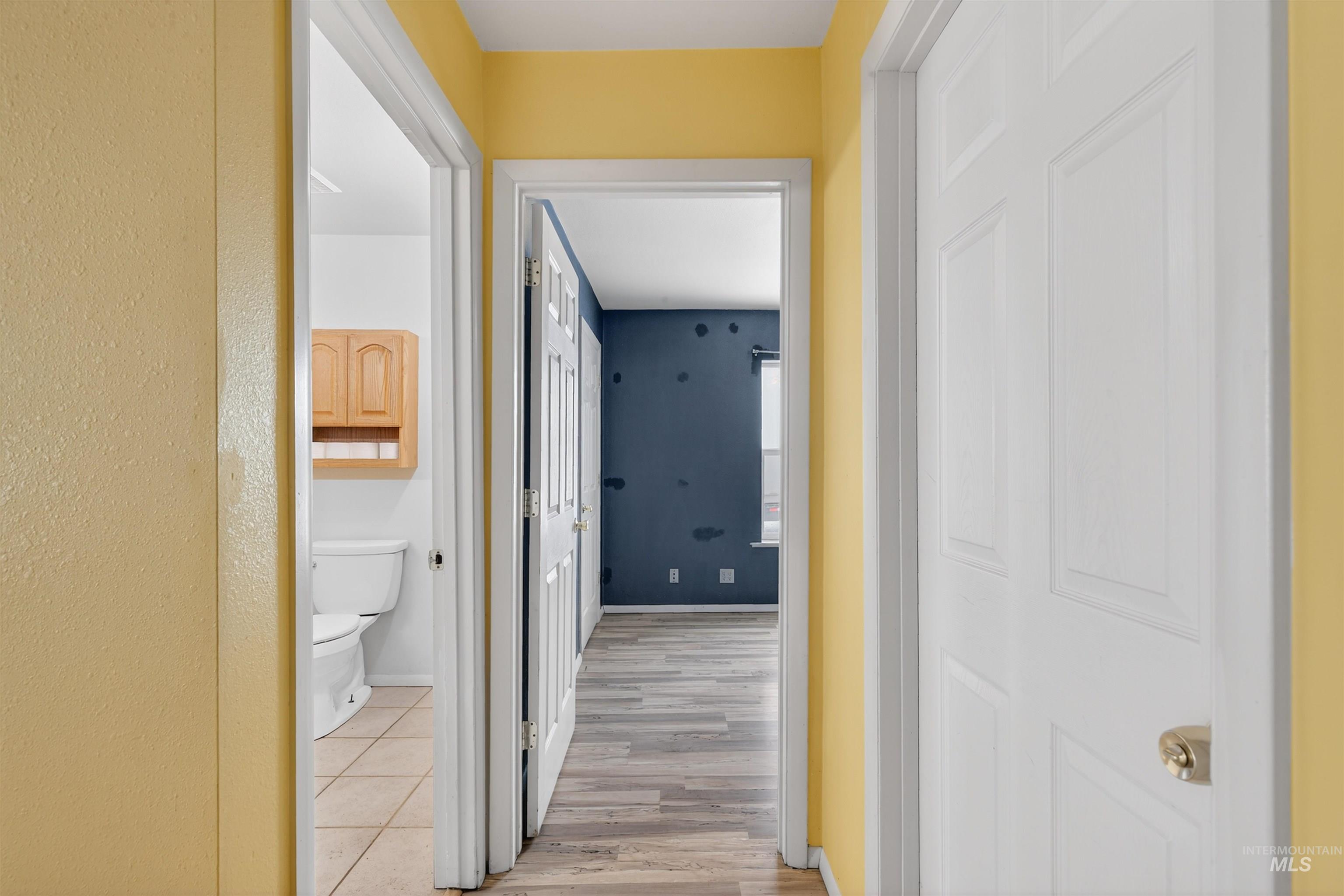 1585 Woodside Road Winchester, ID 83555 - Photo 10 of 47 Hall featuring light wood-style floors and baseboards