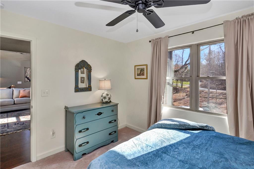 196 Grayson Point Blue Ridge, GA 30513 - Photo 19 of 42 a bedroom with a bed and a dresser