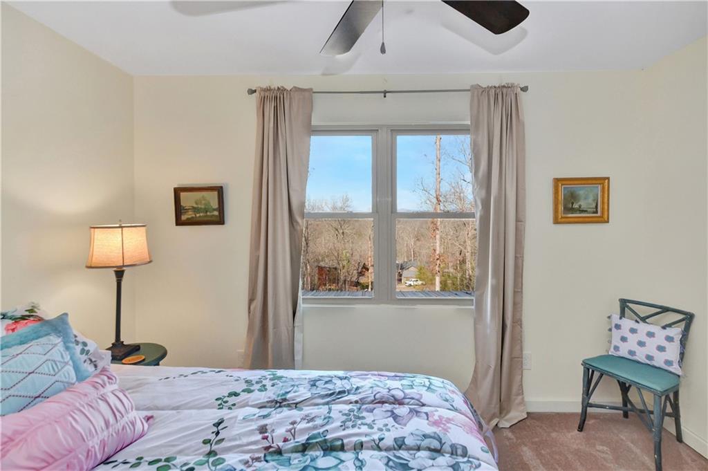 196 Grayson Point Blue Ridge, GA 30513 - Photo 9 of 42 a bedroom with a bed and a window