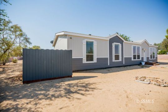 1577 North Calvert Boulevard Ridgecrest, CA 93555 - Photo 2 of 35 a view of a house with a yard