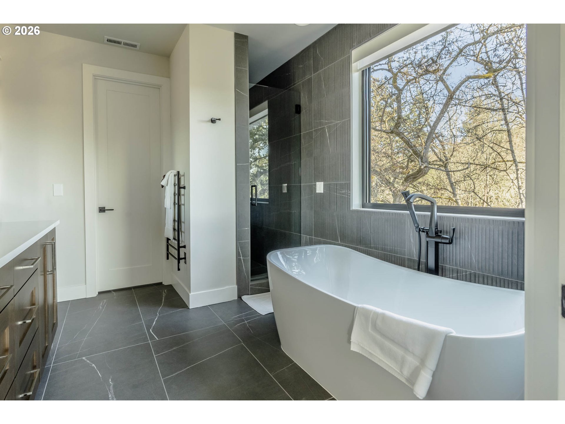 4560 Southwest 59th Avenue Portland, OR 97221 - Photo 25 of 30 a bathroom with a bathtub and a sink