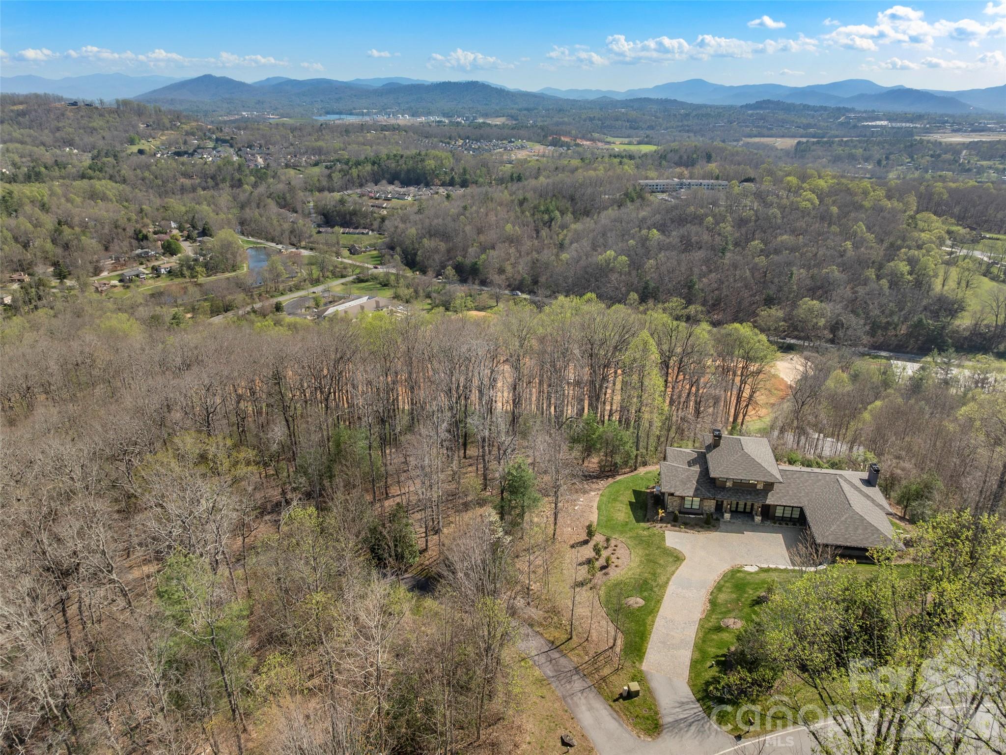 44 Pine Ridge Trail, Unit 83 Arden, NC 28704 - Photo 20 of 26 a view of a lake with a mountain