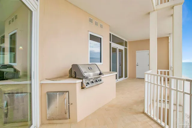 a hall with wooden floor and furniture
