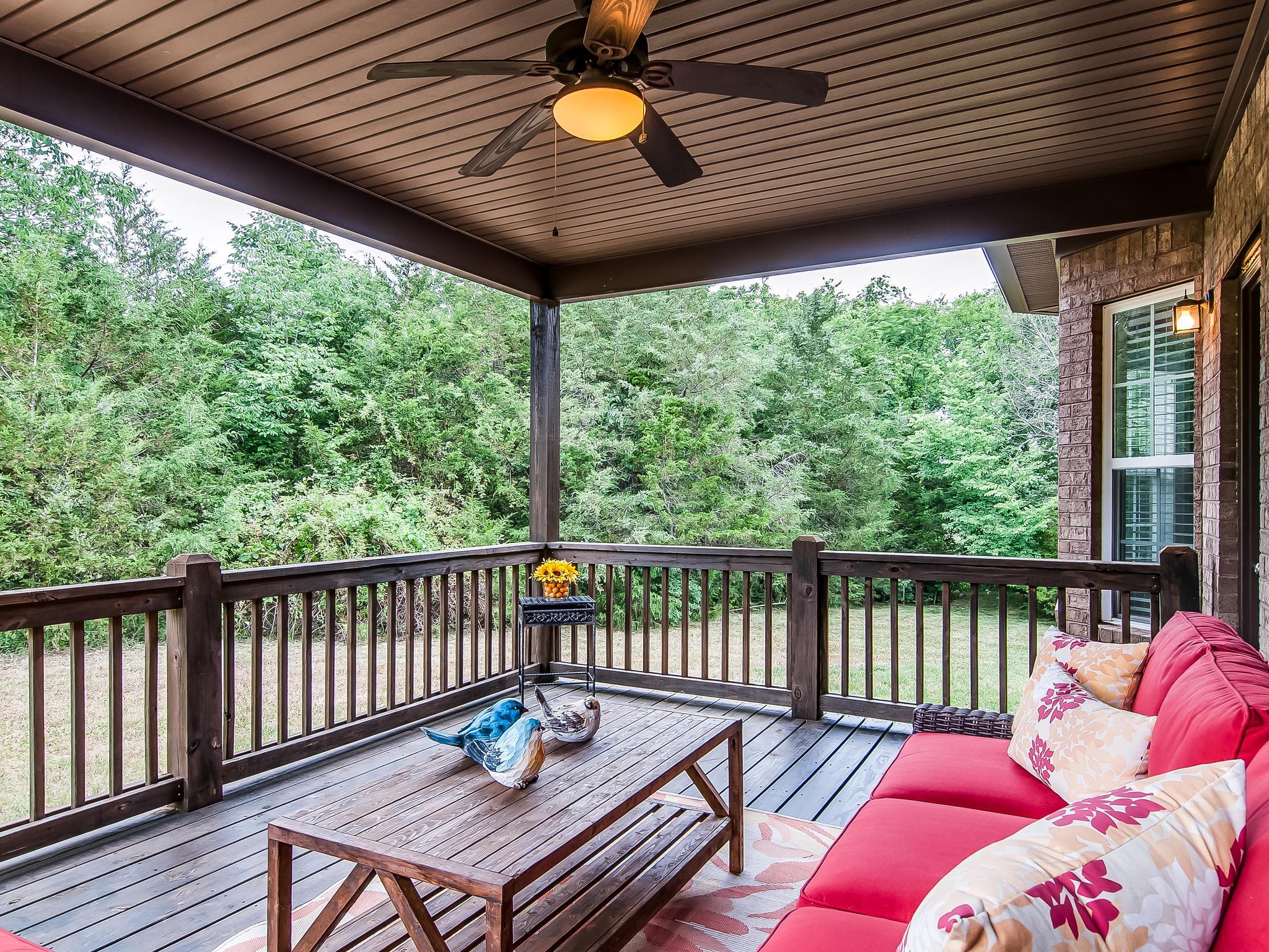 2235 Harkreader Road Mount Juliet, TN 37122 - Photo 22 of 23 a balcony with wooden floor and outdoor seating