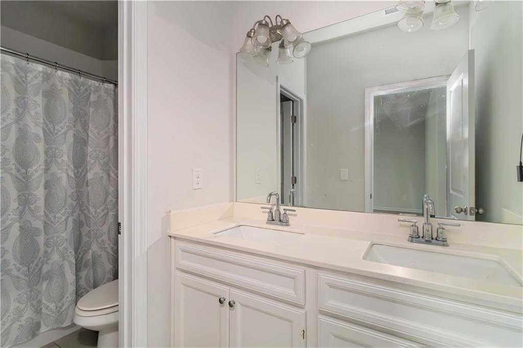 355 Chestnut Chase Hoschton, GA 30548 - Photo 15 of 22 a bathroom with a sink and a mirror