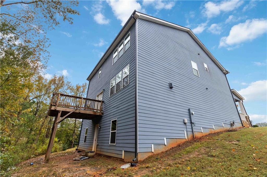 355 Chestnut Chase Hoschton, GA 30548 - Photo 20 of 22 a view of a house with a roof deck