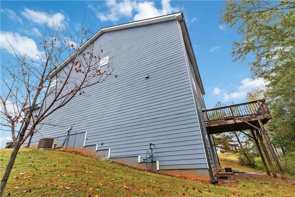 355 Chestnut Chase Hoschton, GA 30548 - Photo 21 of 22 a front view of a house with a yard