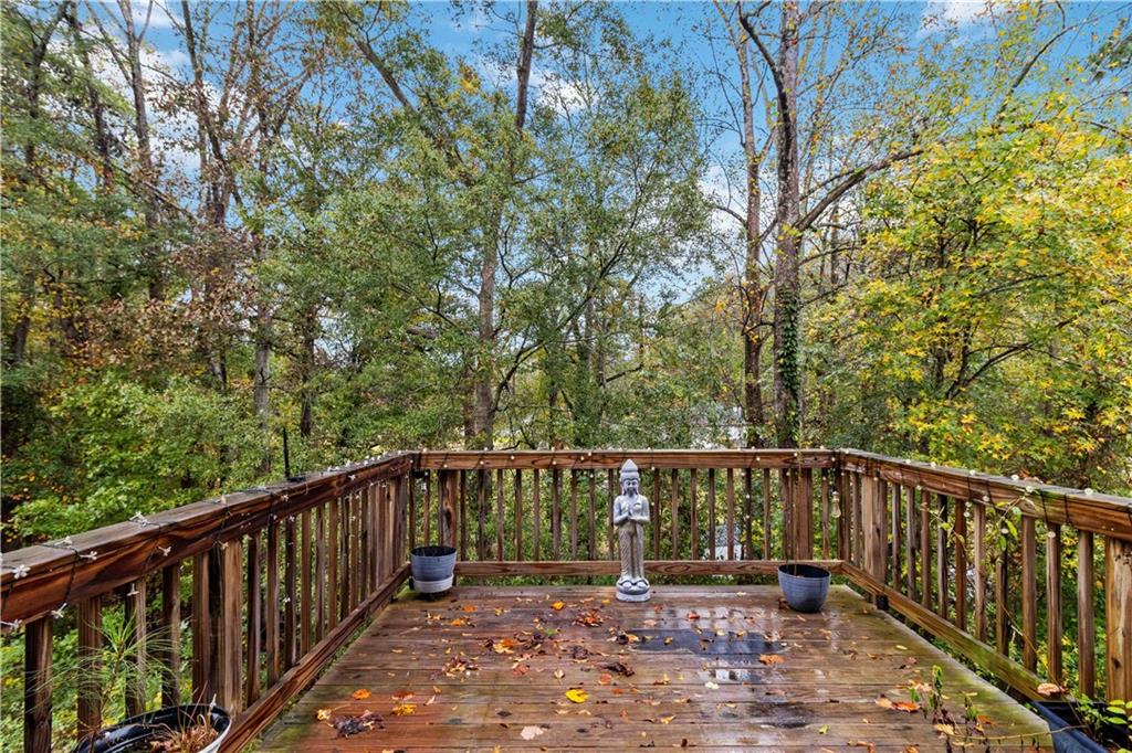 355 Chestnut Chase Hoschton, GA 30548 - Photo 22 of 22 a view of a wooden deck with trees