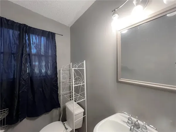 a bathroom with a toilet and shower