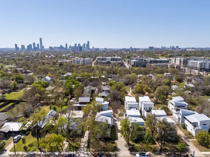 an aerial view of a city with lots of residential buildings