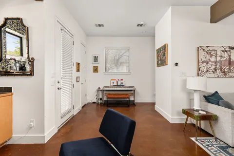 a bedroom with furniture and a window