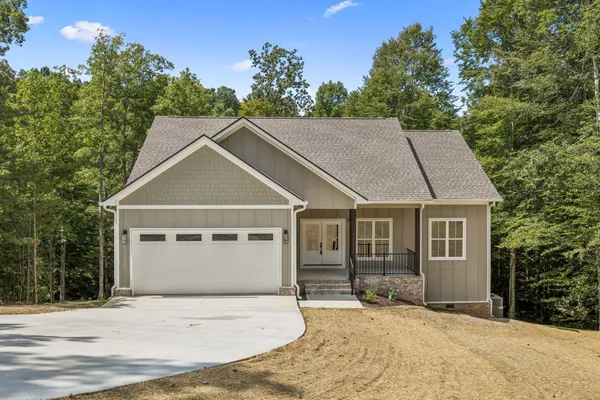 a house with trees in the background