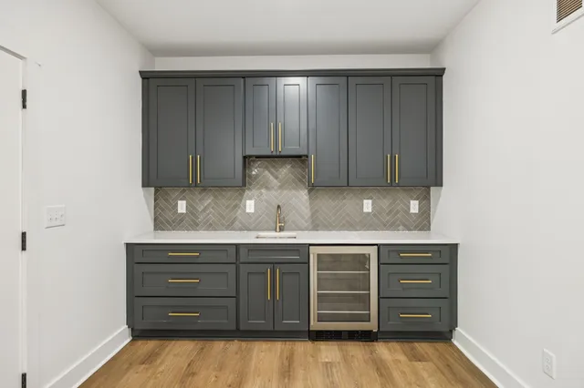 a kitchen with a sink and cabinets