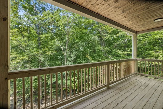 a view of balcony with wooden floor