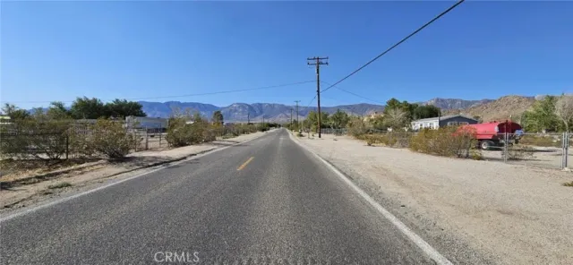 a view of a road with a ocean view