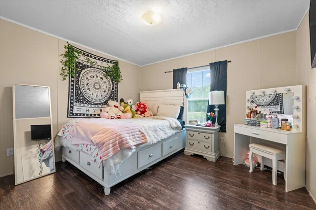 a bedroom with a bed and a bookshelf