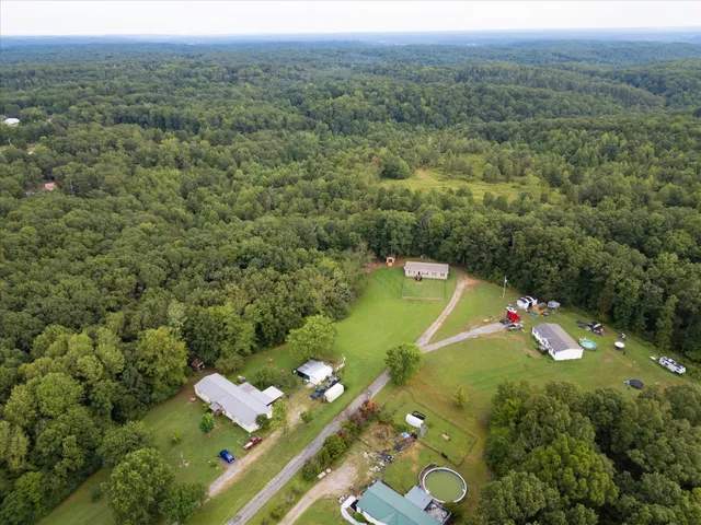 an aerial view of a house with a garden