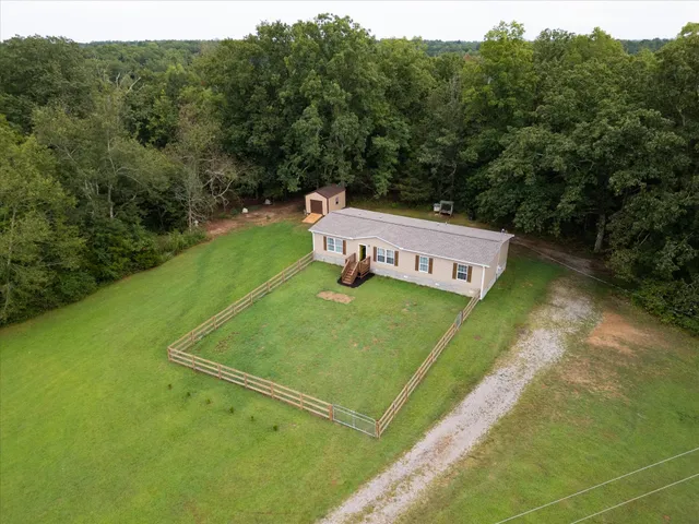 a view of a chairs in a backyard