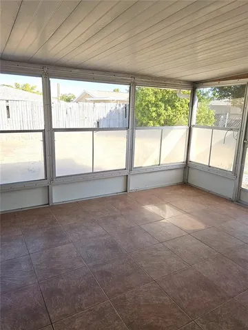 a view of an empty room with a large window