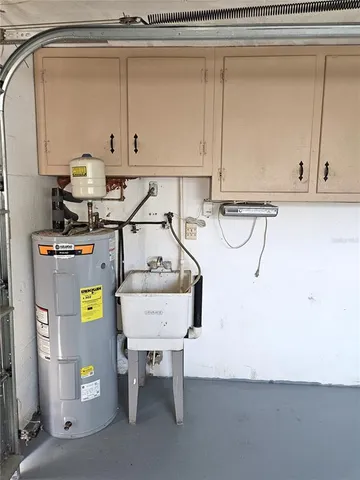 a view of a storage and utility room with a sink
