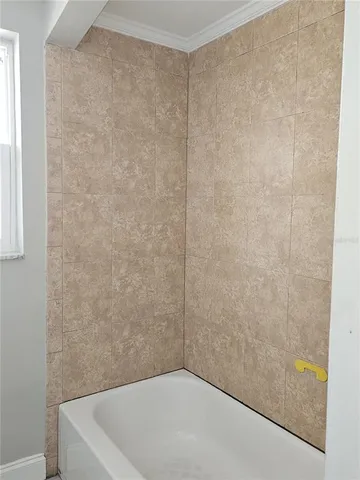 a bathroom with a white bath tub