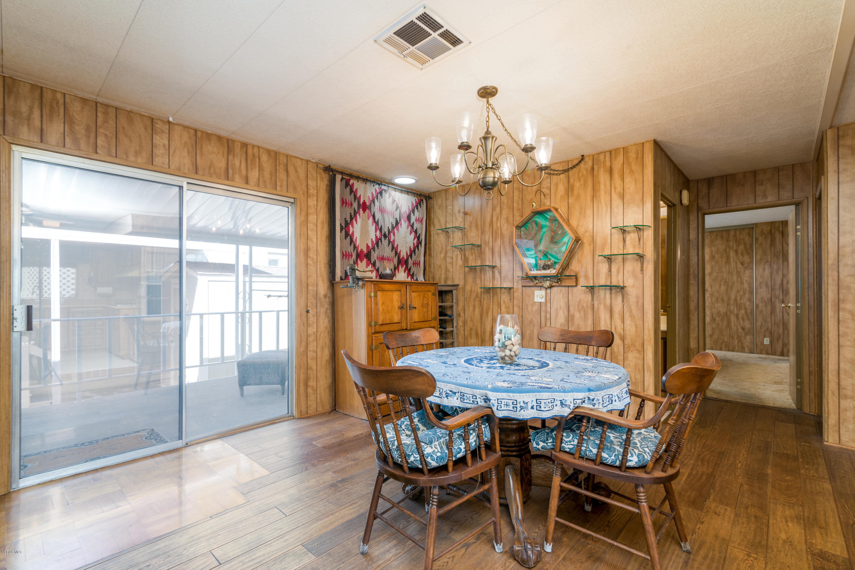 6480 Katherine Street, Unit 16 Simi Valley, CA 93063 - Photo 11 of 24 a view of a dining room with furniture window and wooden floor