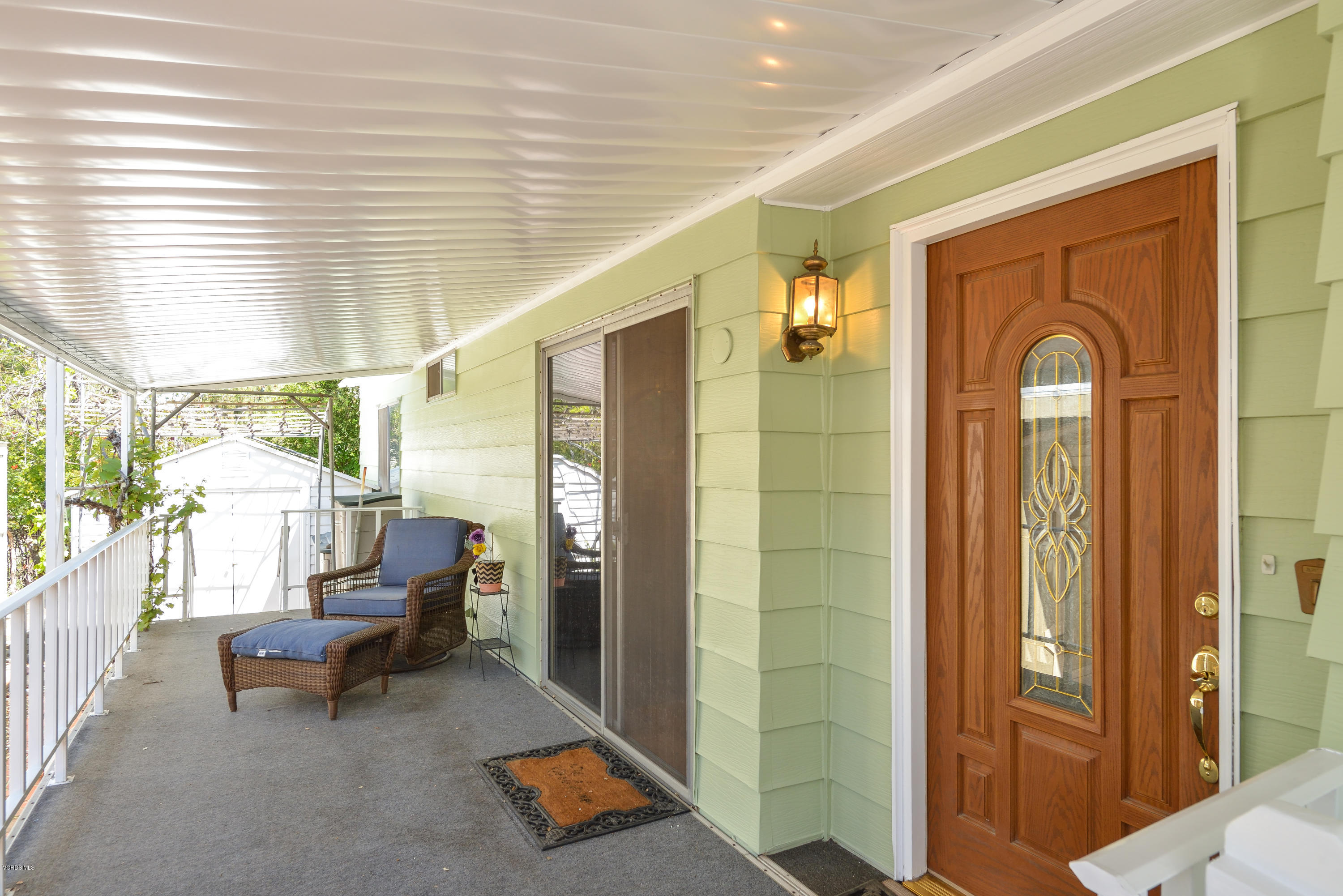 6480 Katherine Street, Unit 16 Simi Valley, CA 93063 - Photo 18 of 24 a living room with furniture and a large window