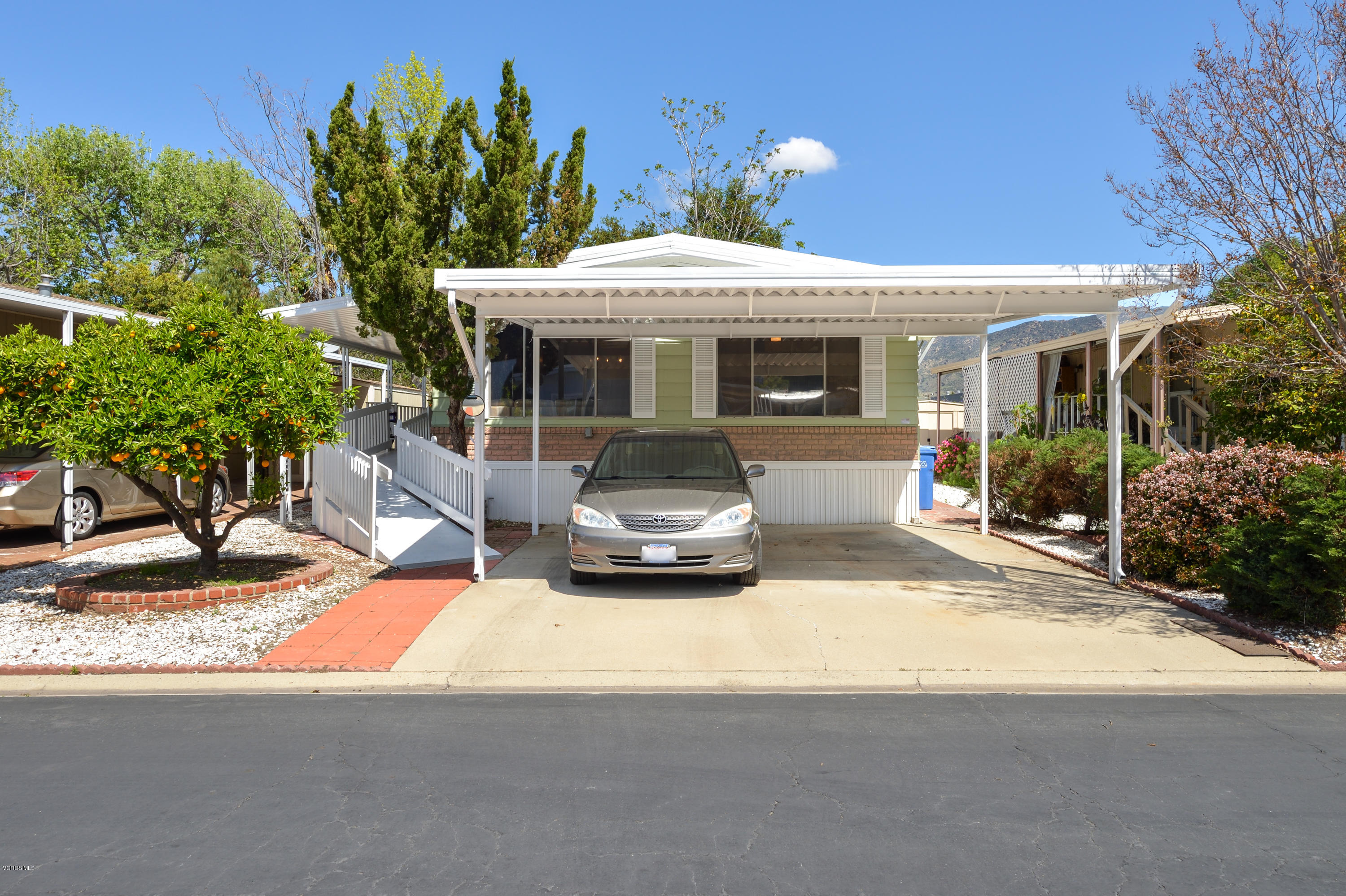 6480 Katherine Street, Unit 16 Simi Valley, CA 93063 - Photo 20 of 24 a front view of a house with garden