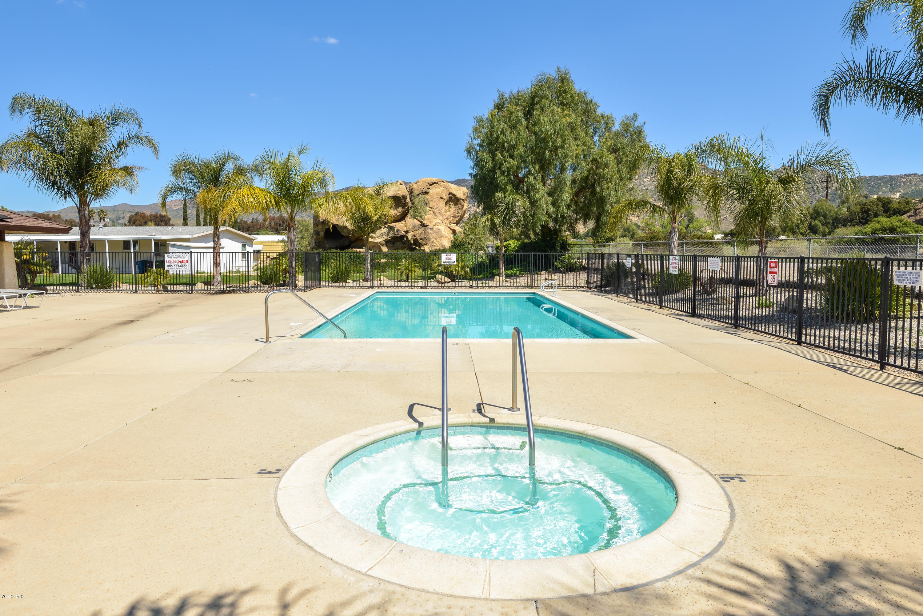 6480 Katherine Street, Unit 16 Simi Valley, CA 93063 - Photo 24 of 24 a swimming pool with an outdoor seating
