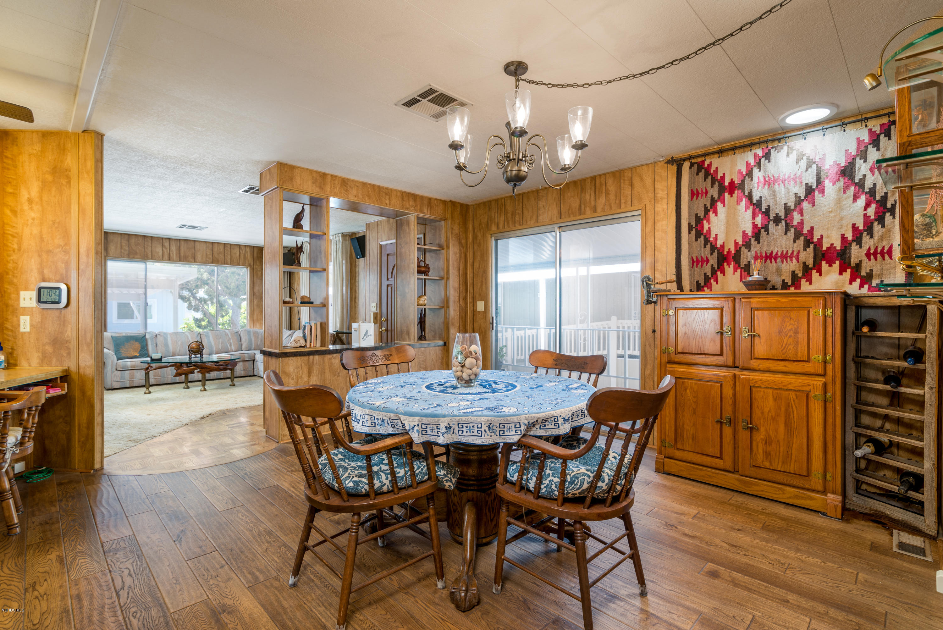6480 Katherine Street, Unit 16 Simi Valley, CA 93063 - Photo 4 of 24 a view of a dining room with furniture wooden floor and chandelier